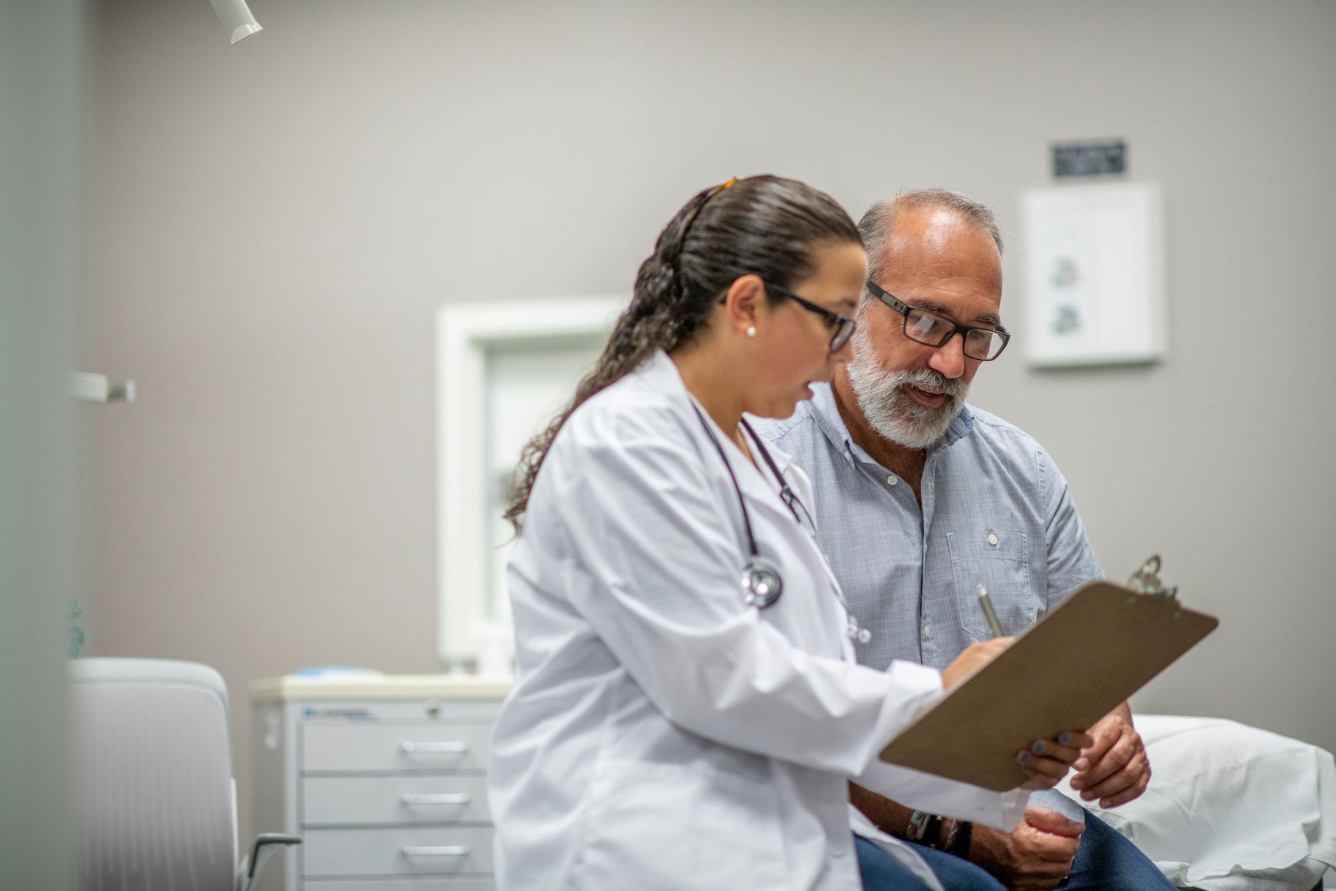 Medical Staff Prepare Their Infectious Control Attire stock photo